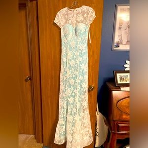 A dress that is white and teal size 4